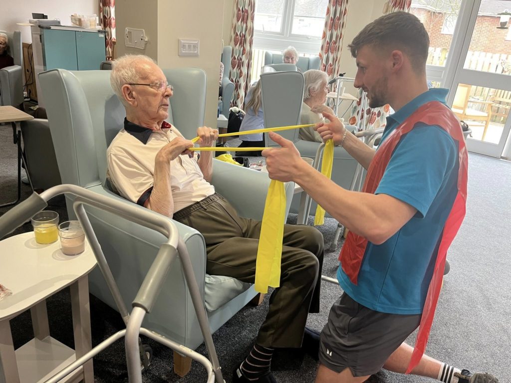 Resident with exercise coach